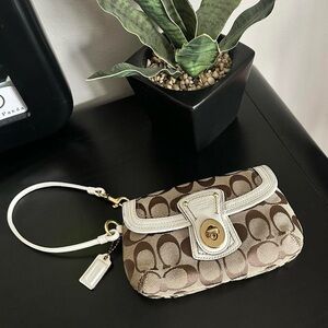 SOLD Coach Signature Turnlock Wristlet